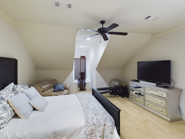 bedroom featuring ceiling fan, light colored carpet, and lofted ceiling