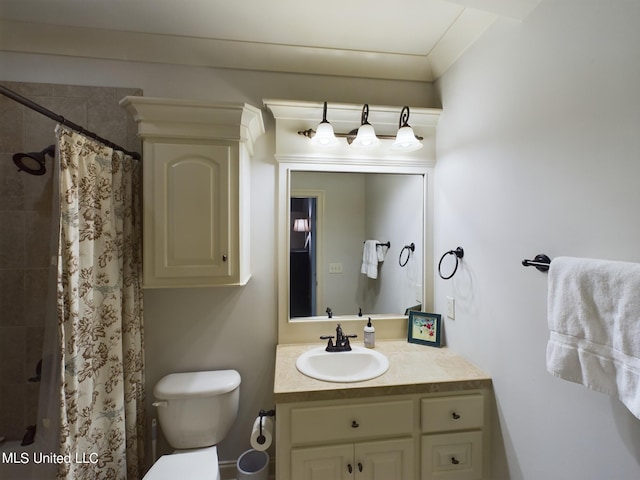 bathroom with vanity, toilet, and walk in shower