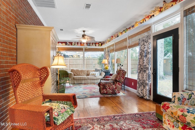 sunroom / solarium with ceiling fan