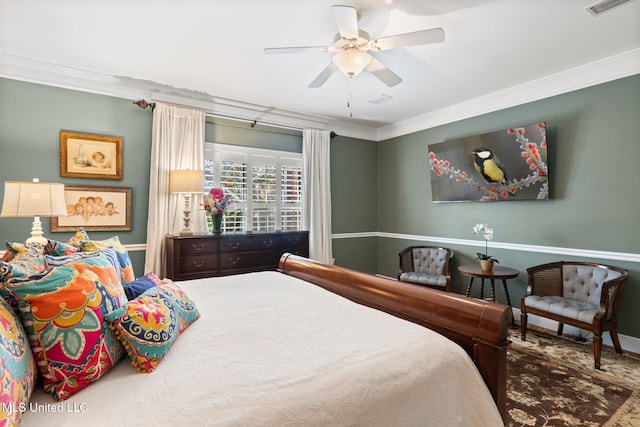 bedroom featuring ceiling fan and ornamental molding