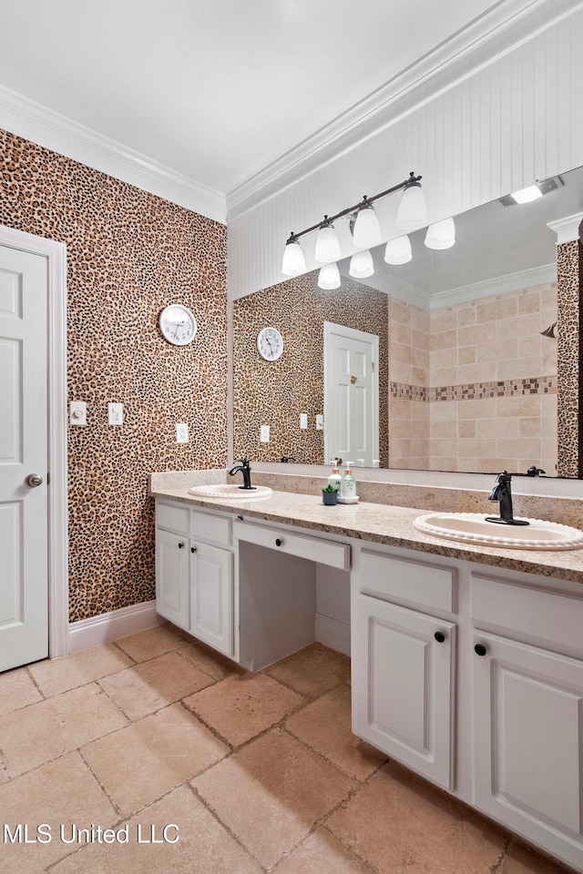 bathroom featuring crown molding and vanity