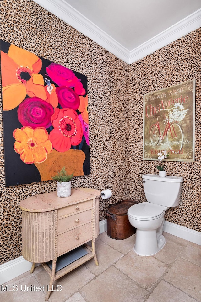 bathroom with toilet and crown molding