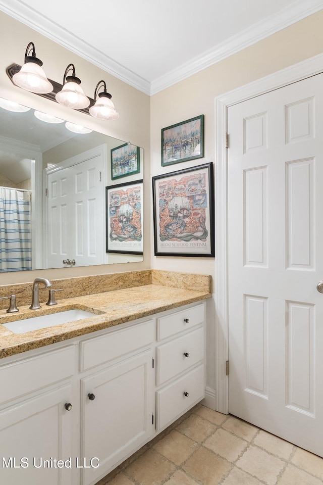 bathroom with vanity, ornamental molding, and walk in shower