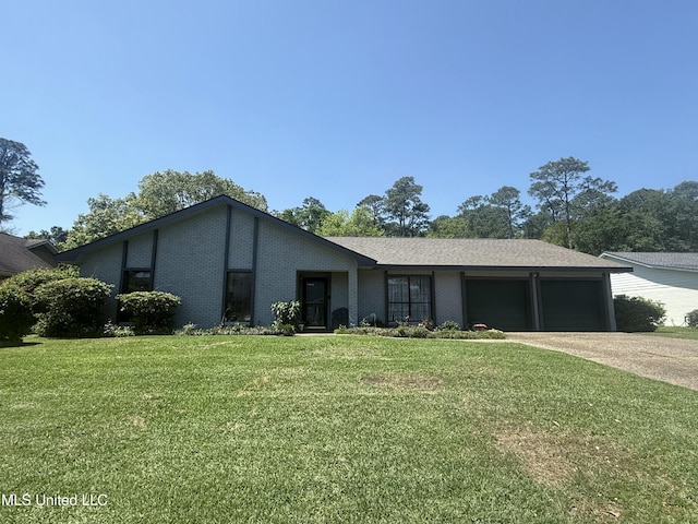 419 Cove Dr, Biloxi, MS 39531 - single story home featuring concrete driveway, a front yard, brick siding, and an attached garage