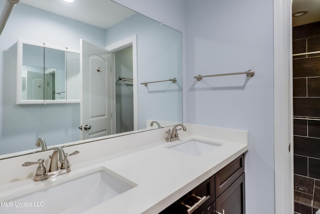 419 Cove Dr, Biloxi, MS 39531 - bathroom featuring a sink and double vanity