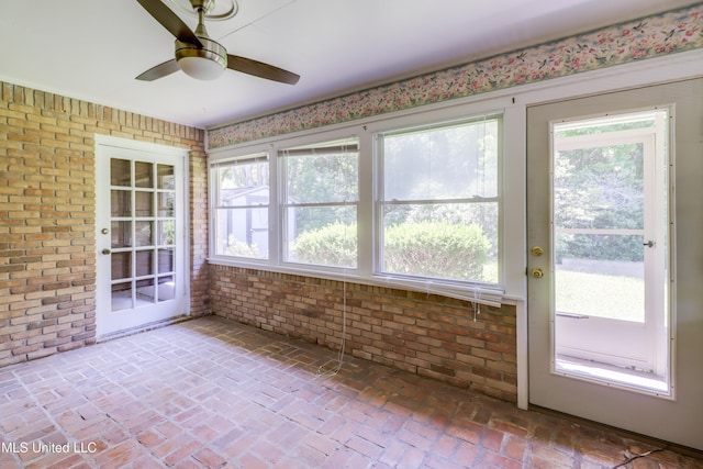 419 Cove Dr, Biloxi, MS 39531 - unfurnished sunroom featuring brick wall and brick floor
