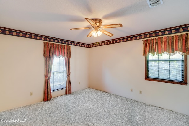 419 Cove Dr, Biloxi, MS 39531 - spare room with carpet flooring, a ceiling fan, and visible vents