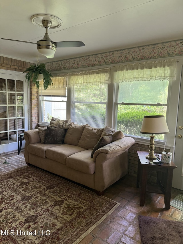 419 Cove Dr, Biloxi, MS 39531 - living area with ceiling fan and brick floor
