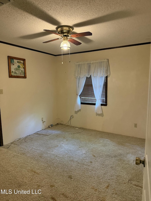 419 Cove Dr, Biloxi, MS 39531 - empty room with carpet flooring, a textured ceiling, visible vents, and a ceiling fan
