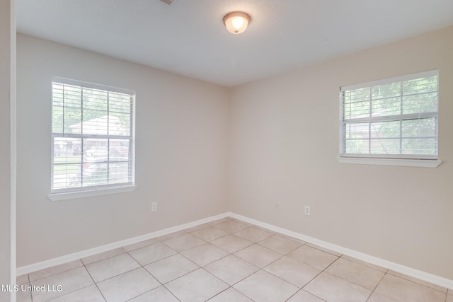 1302 Parktown Dr, Ocean Springs, MS 39564 - spare room featuring baseboards and light tile patterned flooring