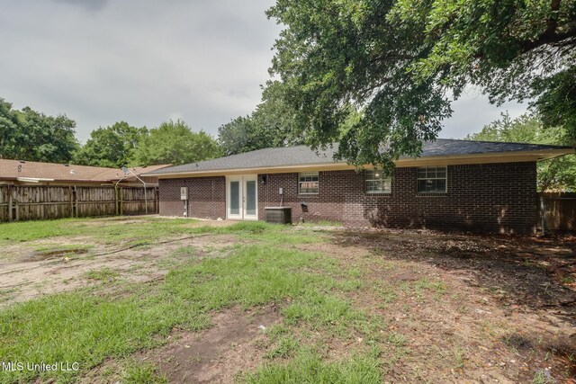 1302 Parktown Dr, Ocean Springs, MS 39564 - rear view of property featuring brick siding, fence, and central air condition unit