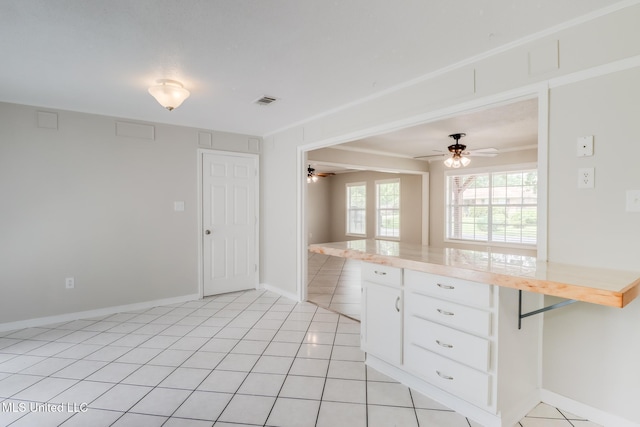 1302 Parktown Dr, Ocean Springs, MS 39564 - kitchen featuring visible vents, baseboards, ceiling fan, light countertops, and white cabinets