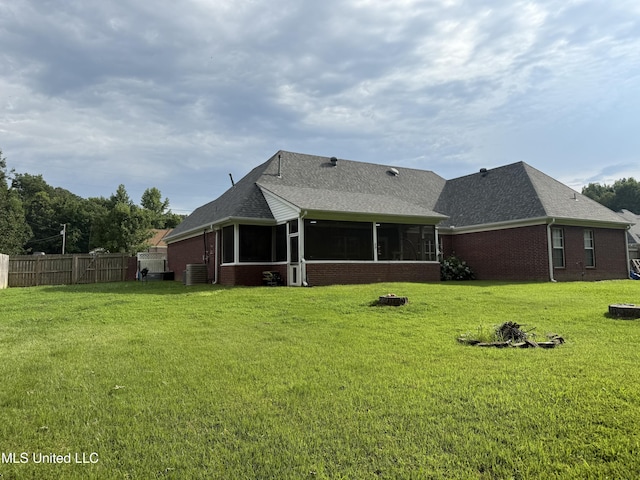 25 Dry Field Rd, Byhalia, MS 38611 - back of house with brick siding, a sunroom, and a shingled roof