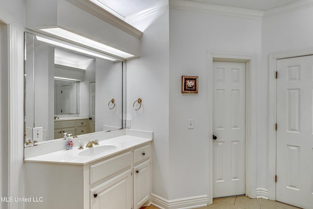 full bath featuring tile patterned floors, baseboards, crown molding, and vanity