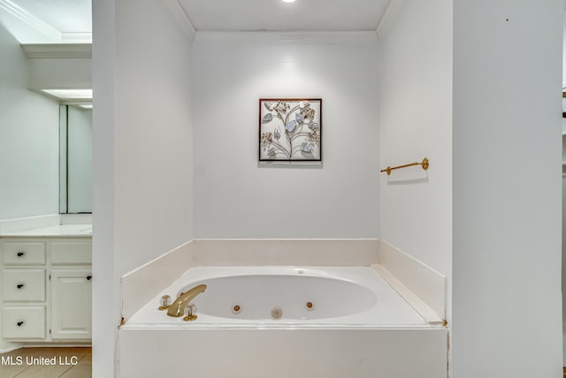 bathroom with a whirlpool tub, tile patterned flooring, ornamental molding, and vanity