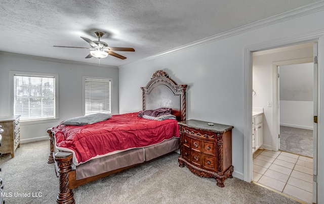 carpeted bedroom with ornamental molding, a ceiling fan, a textured ceiling, and tile patterned floors