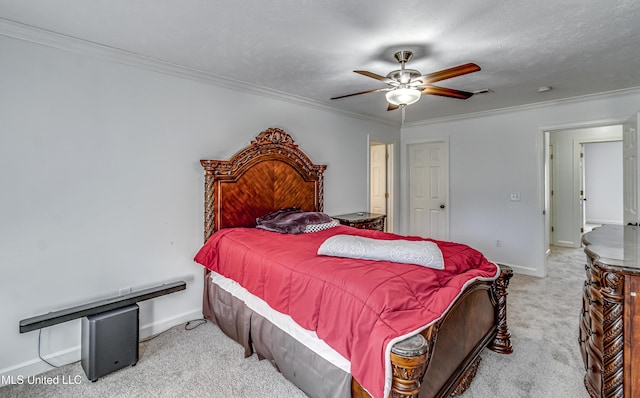 bedroom featuring ornamental molding, carpet, visible vents, and baseboards