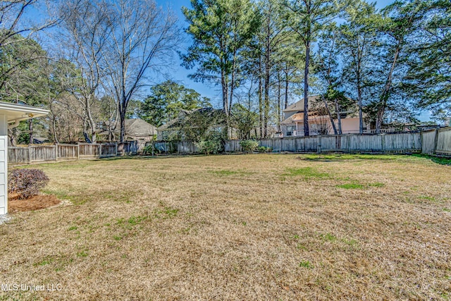 view of yard with a fenced backyard