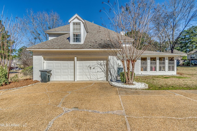 view of front of house with a garage, brick siding, driveway, and roof with shingles