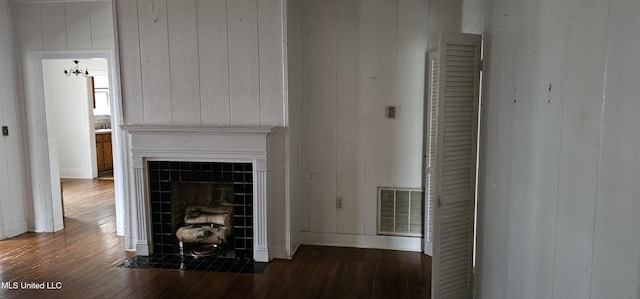 1080 Alta Vista Blvd, Jackson, MS 39209 - detailed view of wood finished floors, a tile fireplace, baseboards, and wooden walls
