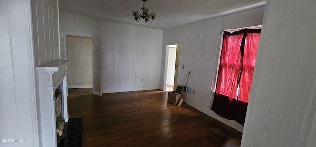 1080 Alta Vista Blvd, Jackson, MS 39209 - unfurnished living room featuring wood finished floors and a chandelier