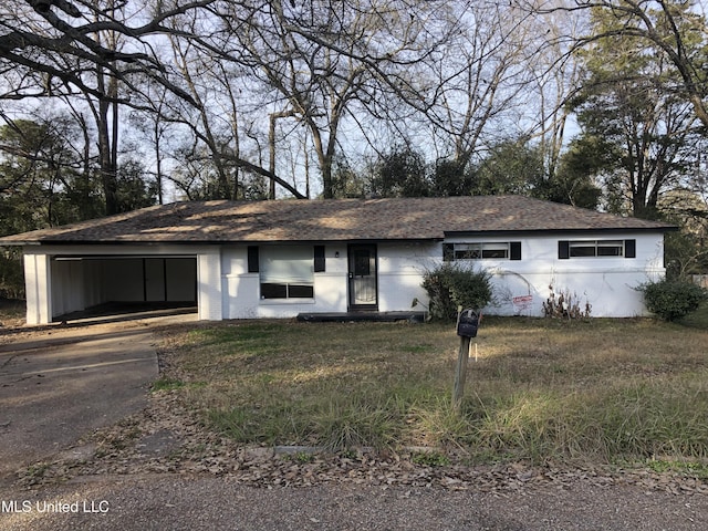 ranch-style house featuring a garage