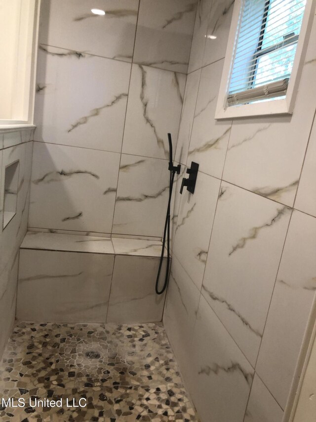 742 Heather Ln, Jackson, MS 39206 - bathroom featuring a marble finish shower
