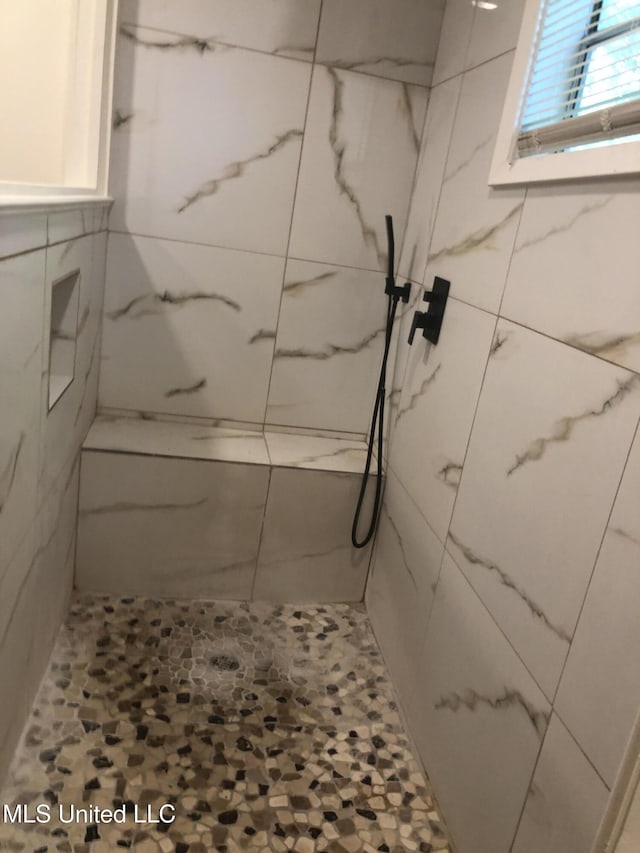 742 Heather Ln, Jackson, MS 39206 - bathroom featuring a marble finish shower