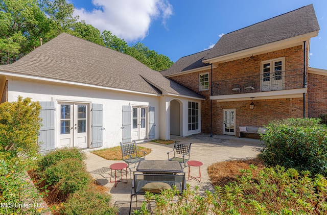 back of house featuring a patio, french doors, a balcony, and ceiling fan