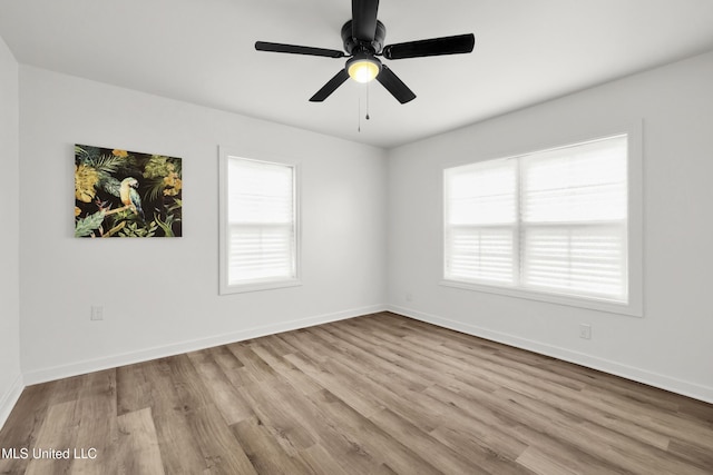 empty room featuring light wood-type flooring and ceiling fan