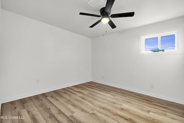 empty room featuring ceiling fan and light hardwood / wood-style floors