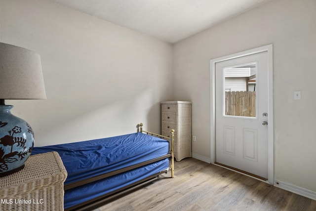 bedroom with light hardwood / wood-style floors