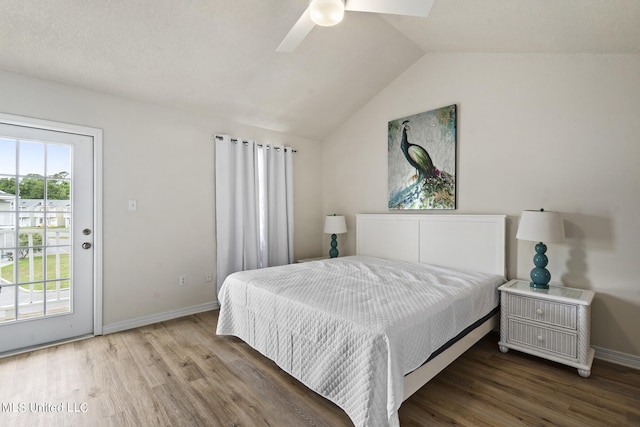 bedroom with lofted ceiling, hardwood / wood-style flooring, access to outside, and ceiling fan