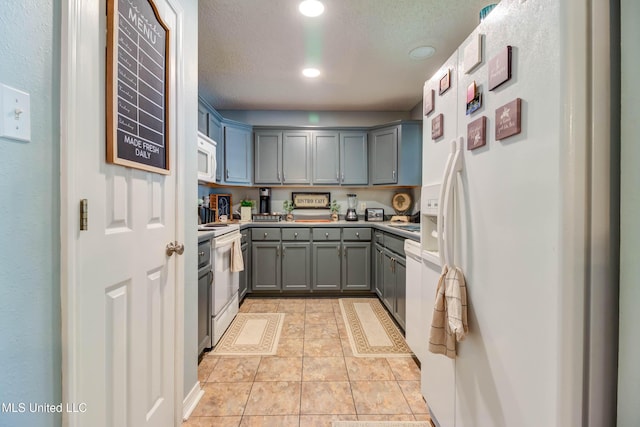 7505 Martin Ct, Ocean Springs, MS 39564 - kitchen featuring white appliances, gray cabinets, recessed lighting, and light countertops