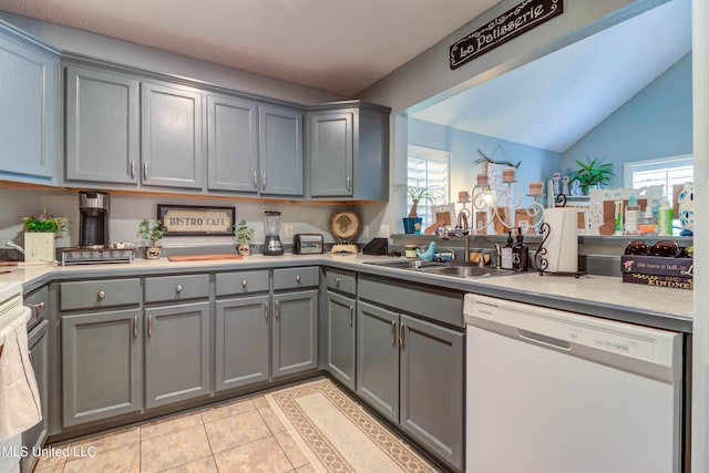 7505 Martin Ct, Ocean Springs, MS 39564 - kitchen featuring white dishwasher, gray cabinets, a sink, light tile patterned floors, and light countertops
