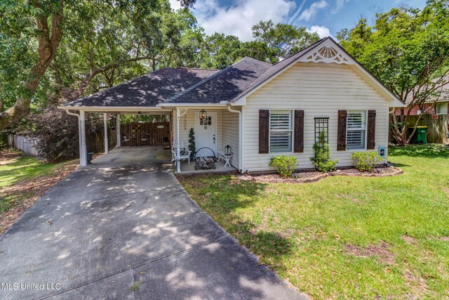 7505 Martin Ct, Ocean Springs, MS 39564 - view of front of home featuring asphalt driveway, a carport, and roof with shingles