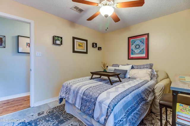 7505 Martin Ct, Ocean Springs, MS 39564 - bedroom featuring a textured ceiling, ceiling fan, and baseboards