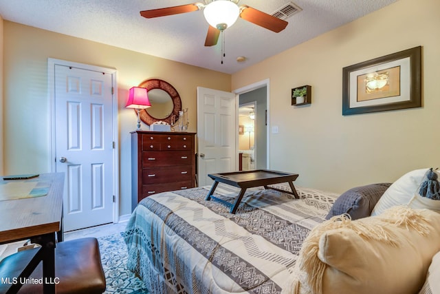 7505 Martin Ct, Ocean Springs, MS 39564 - carpeted bedroom with a ceiling fan and a textured ceiling