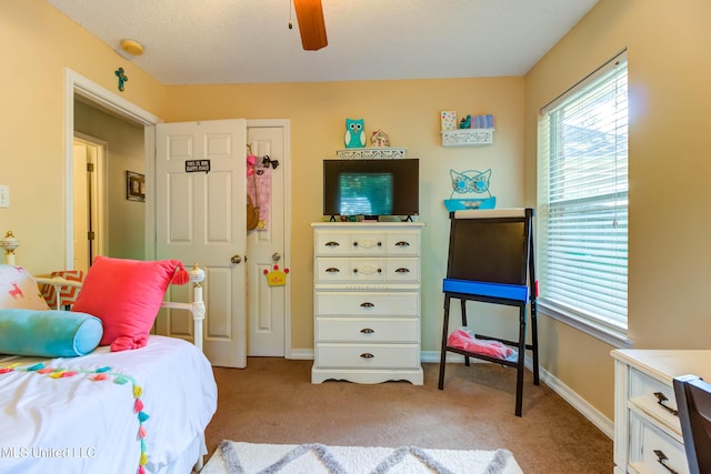 7505 Martin Ct, Ocean Springs, MS 39564 - bedroom with light colored carpet, a ceiling fan, and baseboards