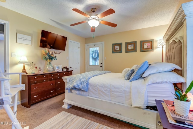 7505 Martin Ct, Ocean Springs, MS 39564 - bedroom with carpet, a textured ceiling, and a ceiling fan