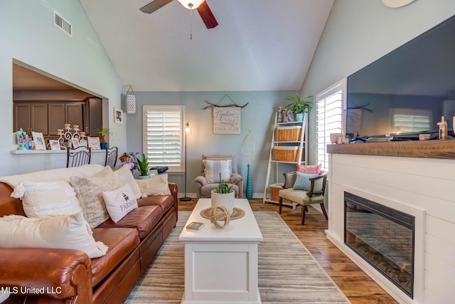 7505 Martin Ct, Ocean Springs, MS 39564 - living area with lofted ceiling, wood finished floors, and ceiling fan