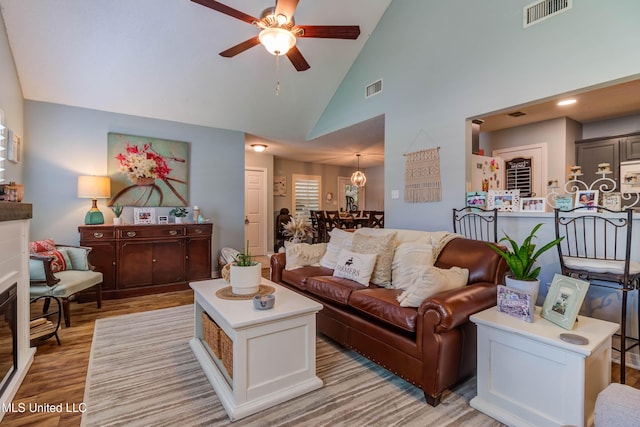 7505 Martin Ct, Ocean Springs, MS 39564 - living room featuring ceiling fan, light wood-type flooring, and high vaulted ceiling