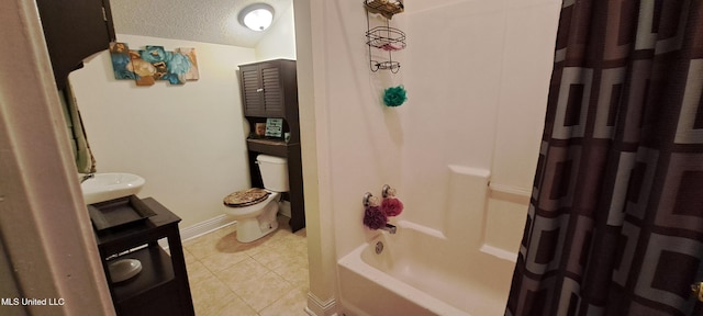 full bathroom featuring toilet, shower / bath combo, vanity, and tile patterned floors