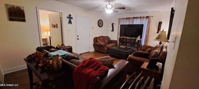 living room with ceiling fan and hardwood / wood-style floors