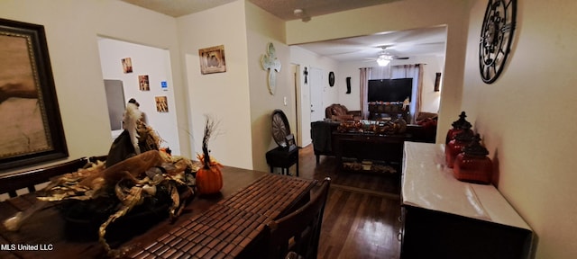 dining room with ceiling fan and dark hardwood / wood-style flooring