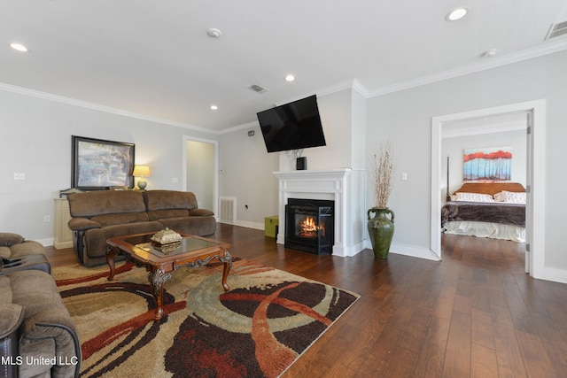 living area with dark wood-style floors, crown molding, and baseboards