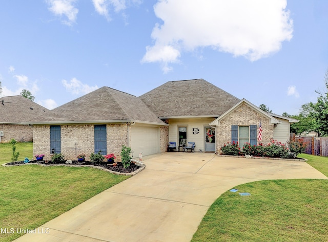 598 Westfield Dr, Pearl, MS 39208 - view of front of property featuring brick siding, an attached garage, a shingled roof, and driveway