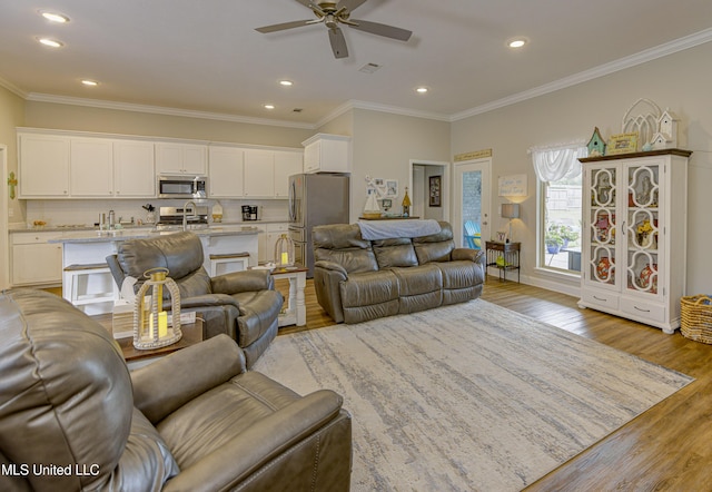 598 Westfield Dr, Pearl, MS 39208 - living area with a ceiling fan, light wood-type flooring, recessed lighting, and ornamental molding