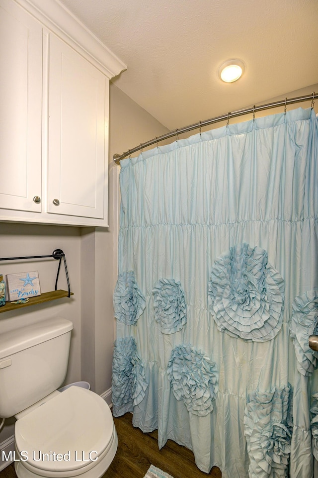 598 Westfield Dr, Pearl, MS 39208 - full bathroom with wood finished floors and a shower with curtain