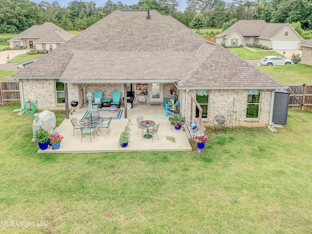 598 Westfield Dr, Pearl, MS 39208 - rear view of property with a shingled roof, brick siding, a fenced backyard, and a patio